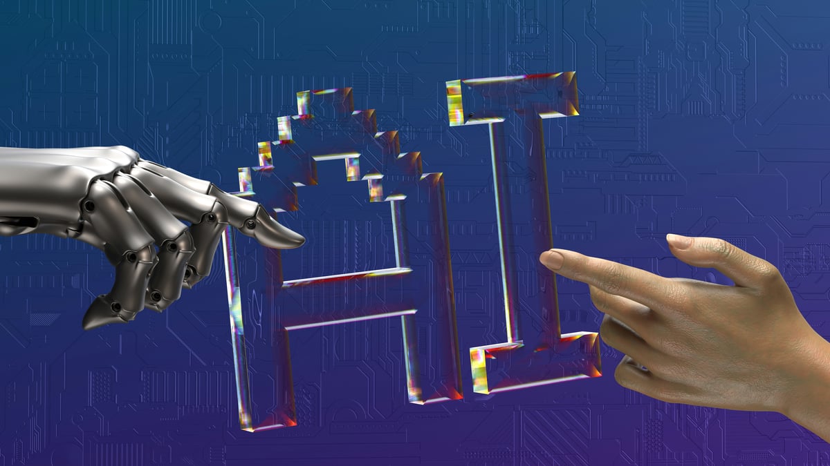 A robotic hand and a human hand reaching toward each other, touching a transparent “AI” symbol against a blue circuit-board background.